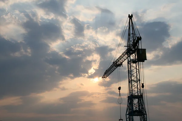 Construction crane silhouette with cool sunset background — Stock Photo, Image