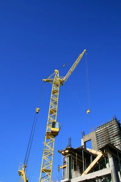 Construction site with yellow crane — Stock Photo, Image