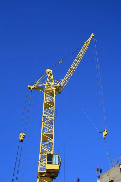 Construction site with yellow crane — Stock Photo, Image