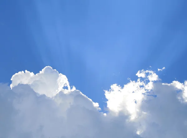 Sunny clouds with rays of light — Stock Photo, Image