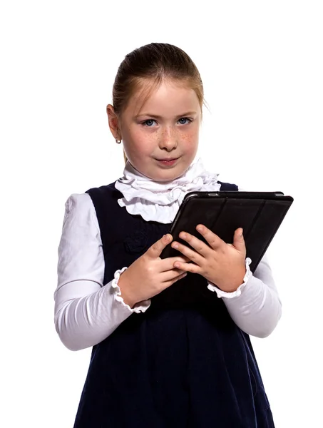 Winking Young school girl ringing a golden bell on white backgro — Stock Photo, Image