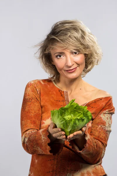 Beautiful woman with green cabbage — Stock Photo, Image