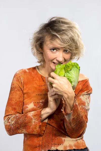 Beautiful woman with green cabbage — Stock Photo, Image