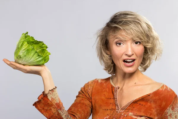 Beautiful woman with green cabbage — Stock Photo, Image