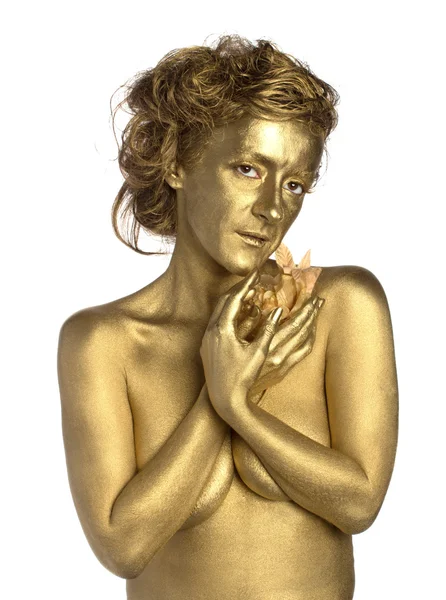 Золотая женщина с цветами — стоковое фото