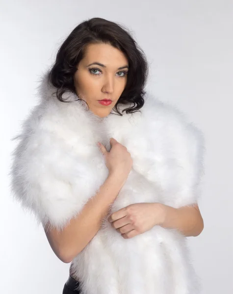 Beautiful girl in a fur shawl — Stock Photo, Image