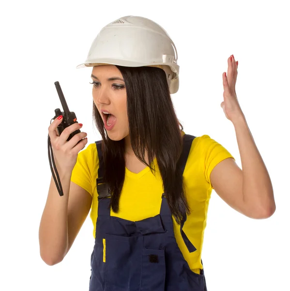 Angry worker looking to walkie-talky — Stock Photo, Image