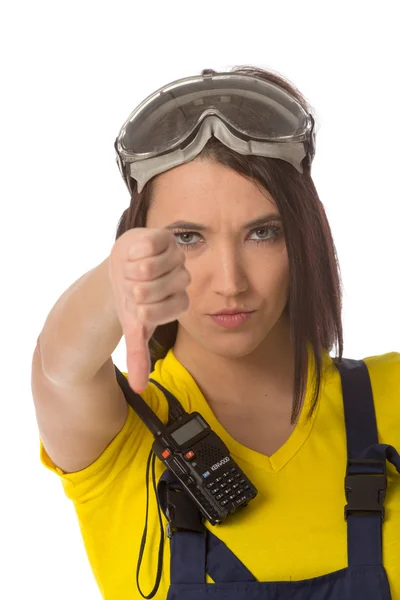 A female construction worker holding a down signal - isolated. — Stock Photo, Image