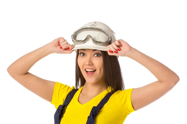 Serious female construction worker in helmet with goggles — Stock Photo, Image