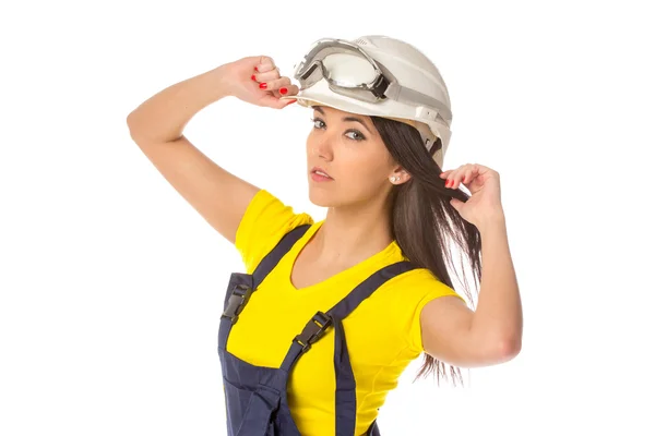 Serious female construction worker in helmet with goggles — Stock Photo, Image