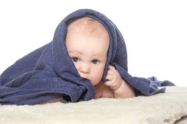 Adorable happy baby in colorful towel — Stock Photo, Image