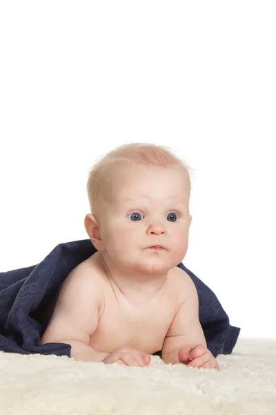 Adorable happy baby in colorful towel — Stock Photo, Image