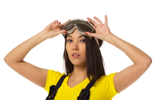 Woman put on safety goggles. — Stock Photo, Image