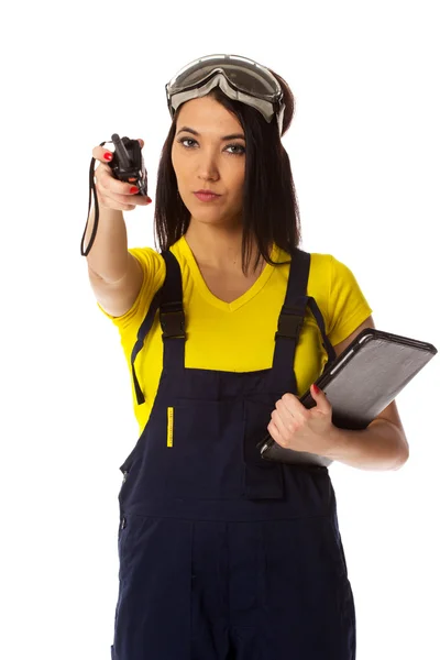 The worker with a handheld transceiver specifies the direction — Stock Photo, Image