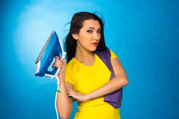 Houseworks, woman hold an iron in hand — Stock Photo, Image