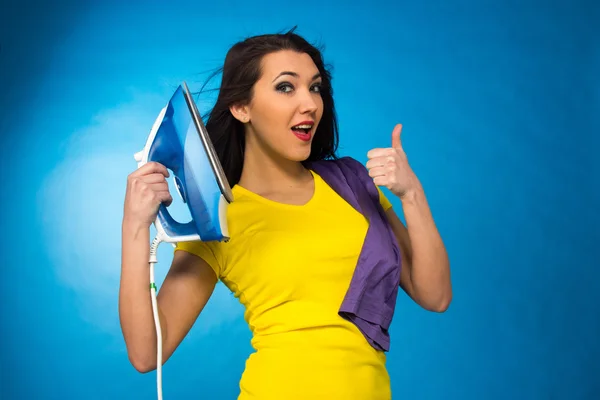 Houseworks, woman hold an iron in hand — Stock Photo, Image