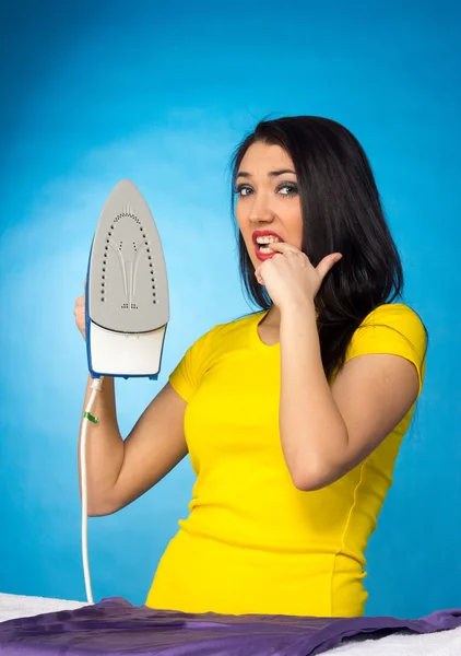 Houseworks, woman with pile of clothes for ironing — Stock Photo, Image