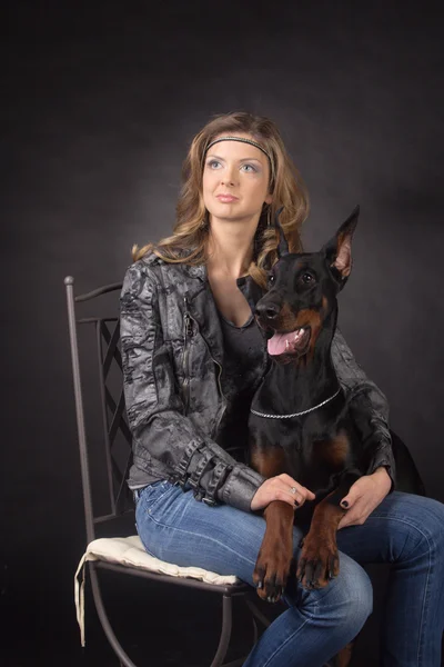 Woman with dobermann dog — Stock Photo, Image