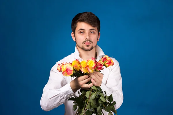 Man with bouquet of red roses — Stock Photo, Image