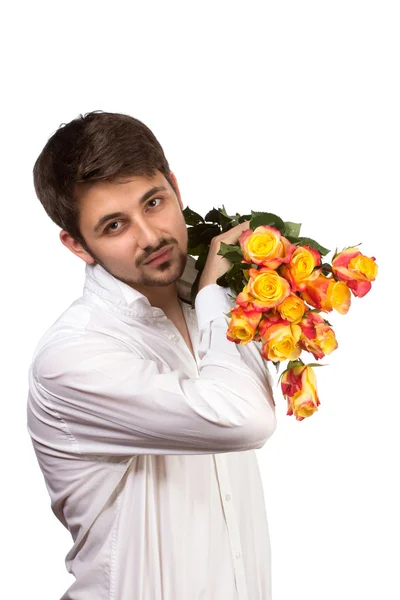 Homem com buquê de rosas vermelhas . — Fotografia de Stock