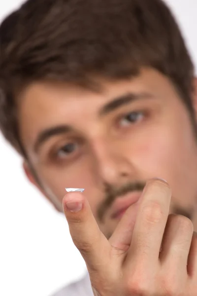 Closeup view of a man's brown eye while inserting a corrective c — Stock Photo, Image