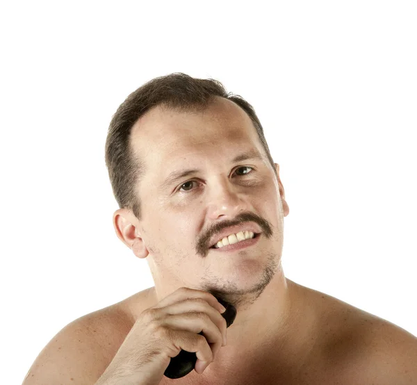 Homem de barbear rosto com lâmina elétrica — Fotografia de Stock