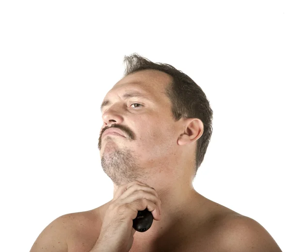 Man shaving face with electric razor — Stock Photo, Image