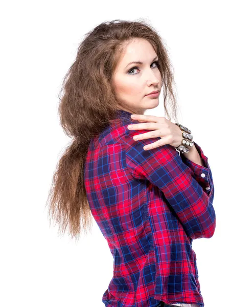 Aantrekkelijke jonge vrouw in een geruit hemd Terugkijkend — Stockfoto
