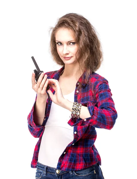 Attractive young woman in a checkered shirt with walkie talkie — Stock Photo, Image