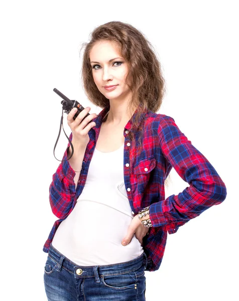 Attractive young woman in a checkered shirt with walkie talkie — Stock Photo, Image