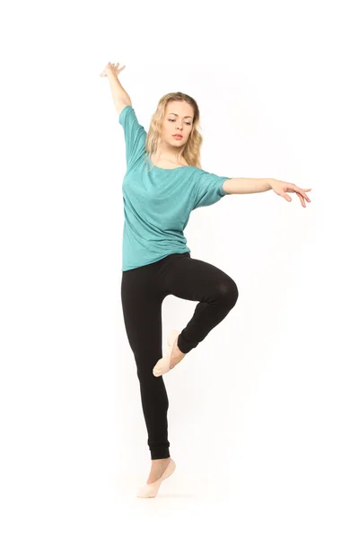 Young beautiful dancer posing on a studio background — Stock Photo, Image