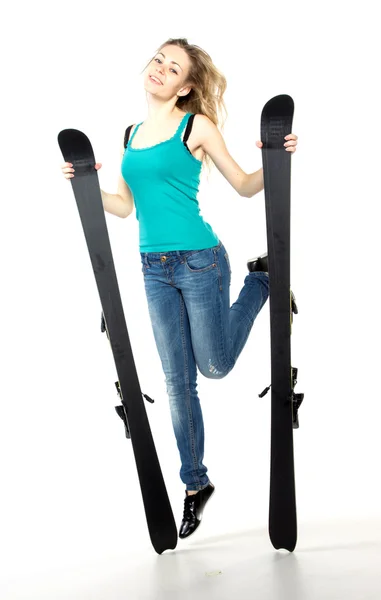 Girl holding ski in studio — Stock Photo, Image