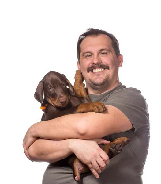 Adulto uomo è tenendo il suo dolce cucciolo isolato su bianco backgroun — Foto Stock