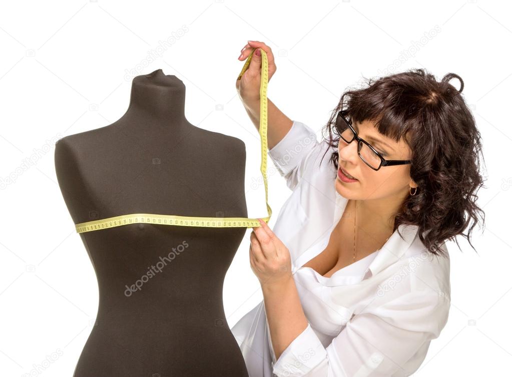 Adult tailor with mannequin
