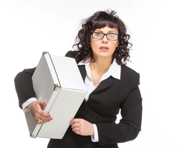 Portrait of mature woman with box, wearing glasses, looking at c — Stock Photo, Image