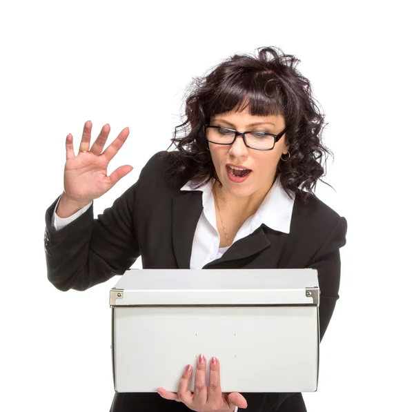 Portrait of mature woman with box, wearing glasses, looking at c — Stock Photo, Image