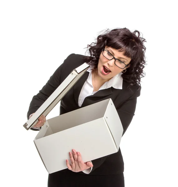 Portrait of mature woman with box, wearing glasses, looking at c — Stock Photo, Image