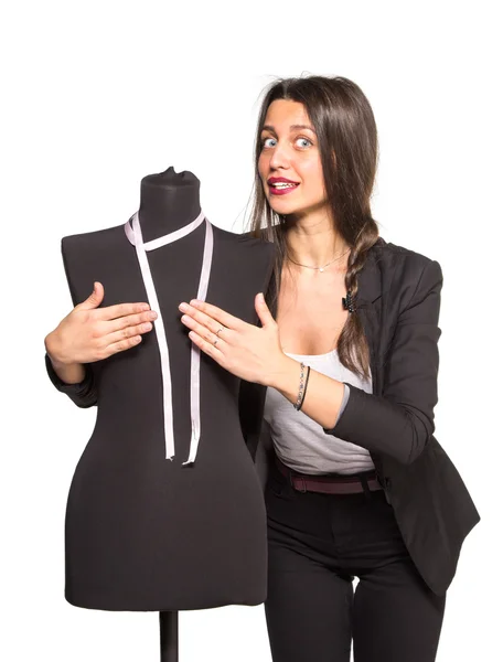 Young tailor posing with mannequin — Stock Photo, Image