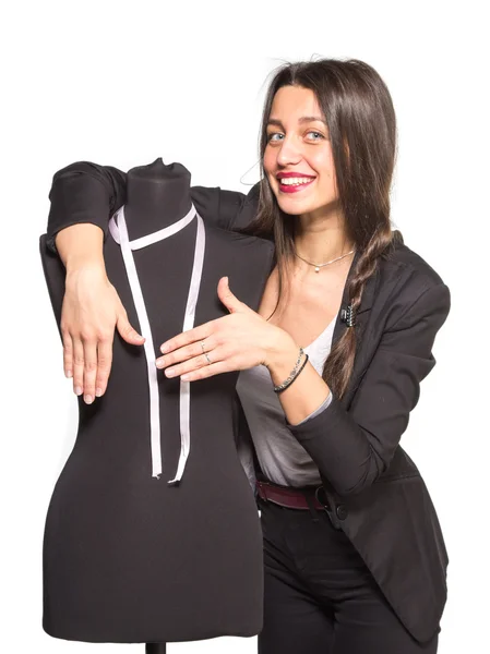 Young tailor posing with mannequin — Stock Photo, Image