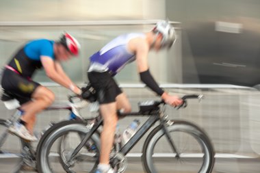 Athlets riding bicycles
