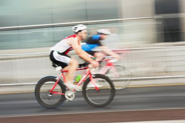 Athlets riding bicycles