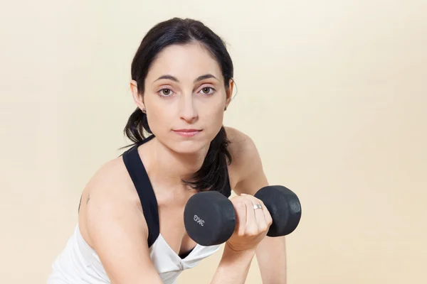 Woman working out with dumbbell — Stock Photo, Image