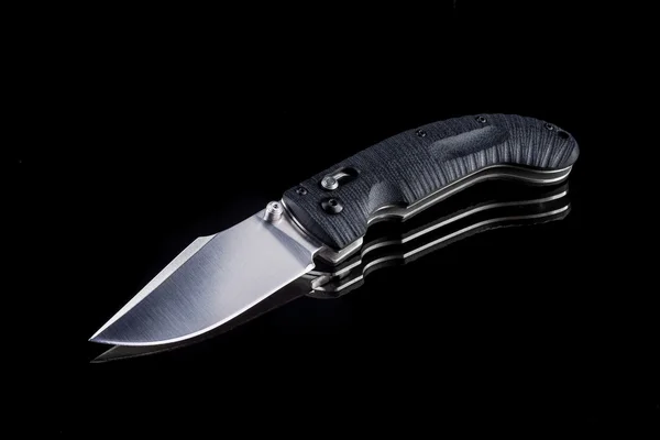 Sharp pocketknife on a black background — Stock Photo, Image