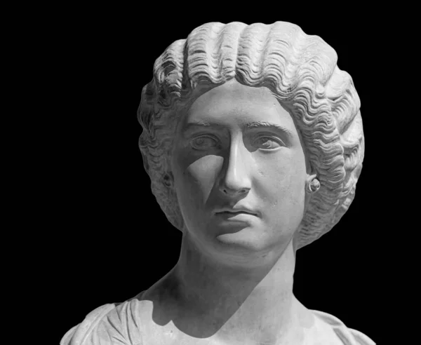 Bust of the Empress Julia Domna. Ancient sculpture isolated on black background. Classic antiquity woman portrait 免版税图库图片