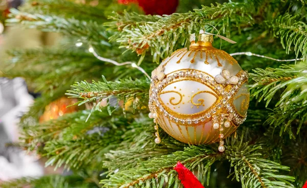 Christmas background - baubles and branch of spruce tree — Stock Photo, Image