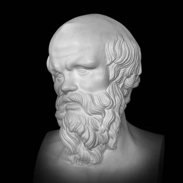 Socrates. Ancient marble statue head of the greek philosopher. Man bust with beard isolated on black background 免版税图库照片
