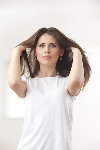 Young woman on white background — Stock Photo, Image