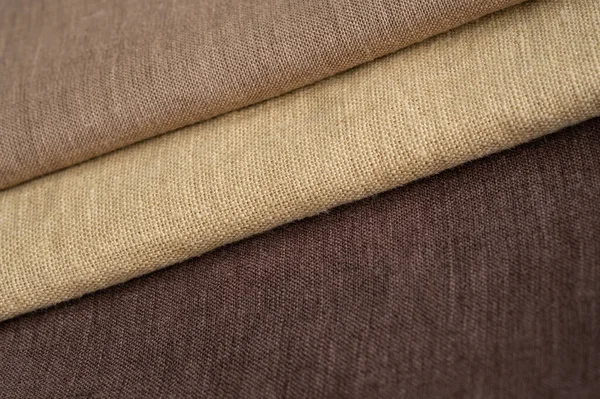 Brown linen pattern texture background. Stripes of fabric