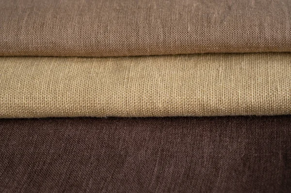 Brown linen pattern texture background. Stripes of fabric. Macro with shallow dof