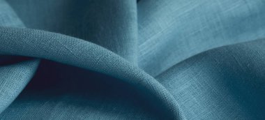 Keten kumaş, mavi arka plan. Yumuşak keten mavi kumaş dokusu. Kumaş kaplama. Sığ noktalı Macro